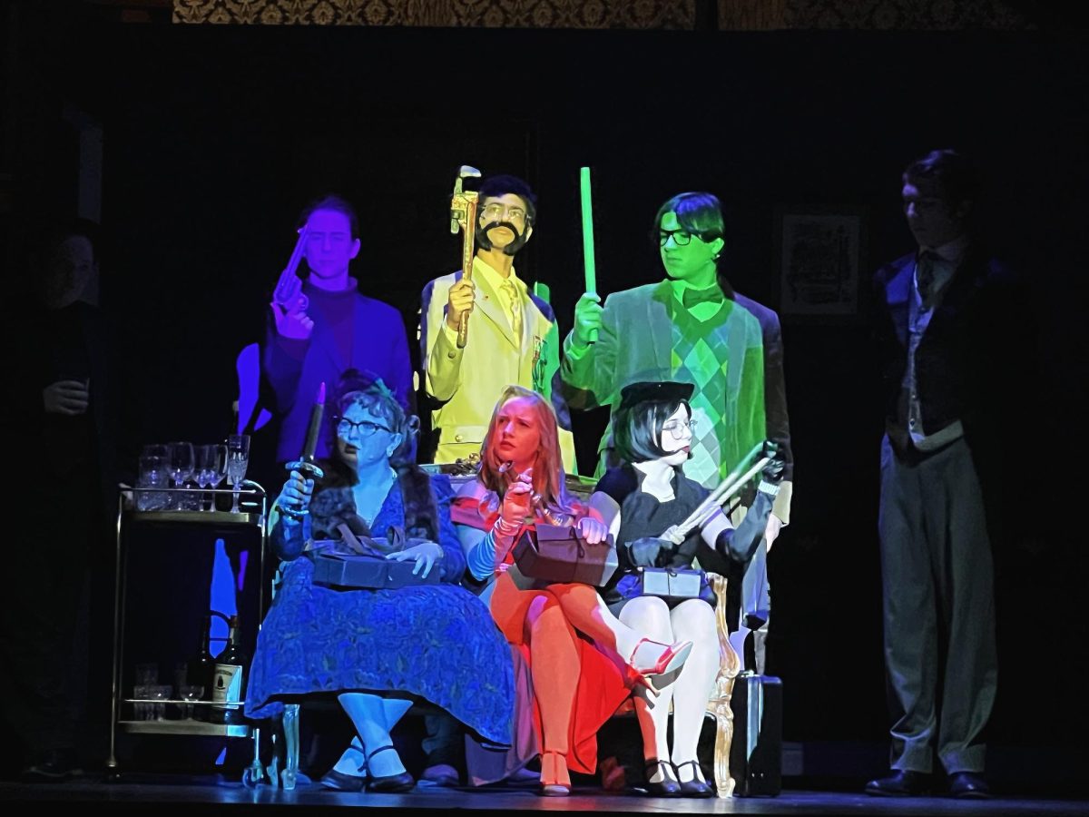 Tech crew brings some color to the stage! Each actor's silhouette is projected onto them in their character color. 