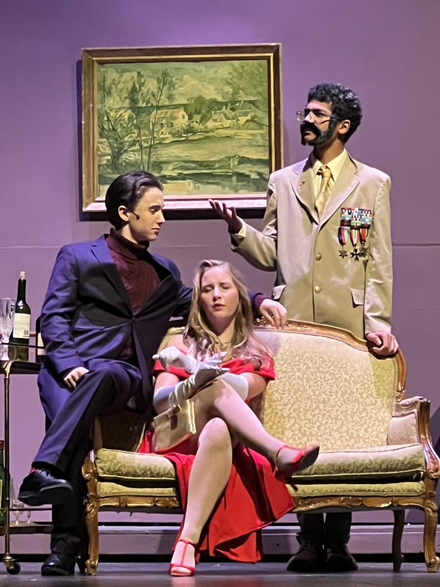 DJ Myers (Colonel Mustard), Finn Pryor (Professor Plum), and Daisy Huller (Miss. Scarlett) all looking guilty.