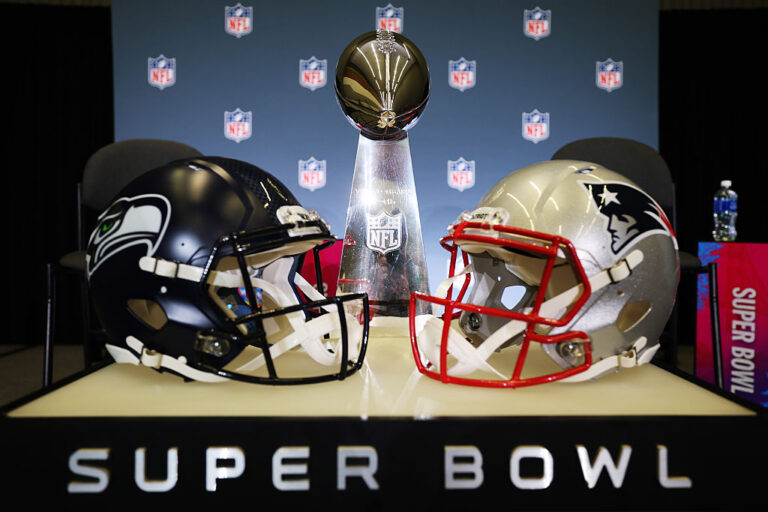 SAN JOSE, CALIFORNIA - FEBRUARY 02:The Vince Lombardi Trophy is framed by the Seattle Seahawks and New England Patriots  helmets during Super Bowl LX Opening Night at San Jose McEnery Convention Center on February 02, 2026 in San Jose, California. (Photo by Chris Graythen/Getty Images)
