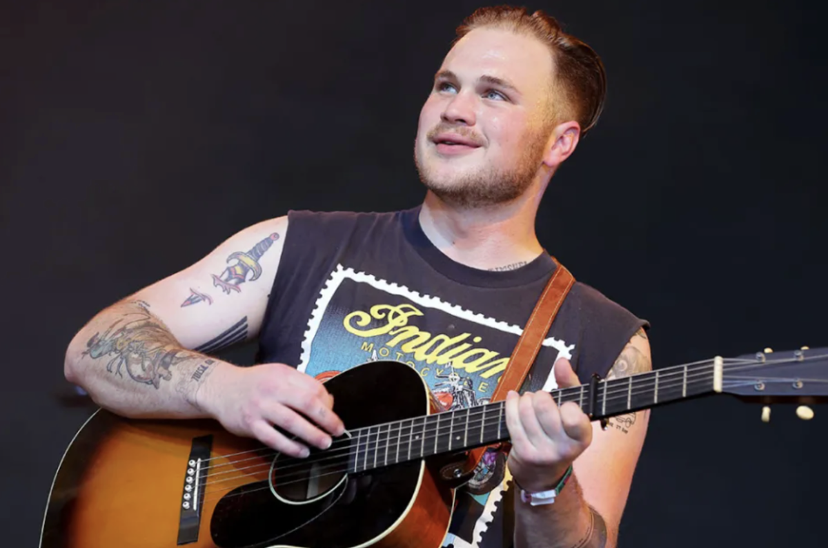 Zach Bryan performing onstage during the Stagecoach Festival in 2022 (Photo Creds: Billboard)